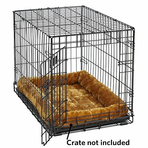 Wire dog crate with a brown bed inside.