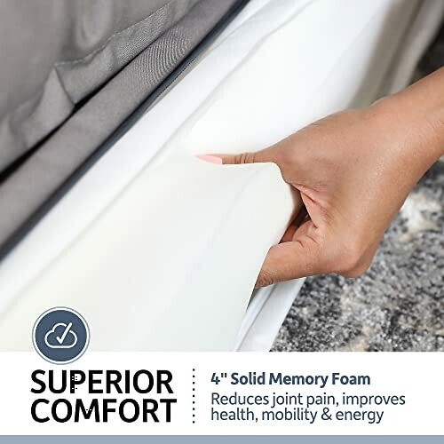 Hand touching 4-inch solid memory foam for superior comfort.